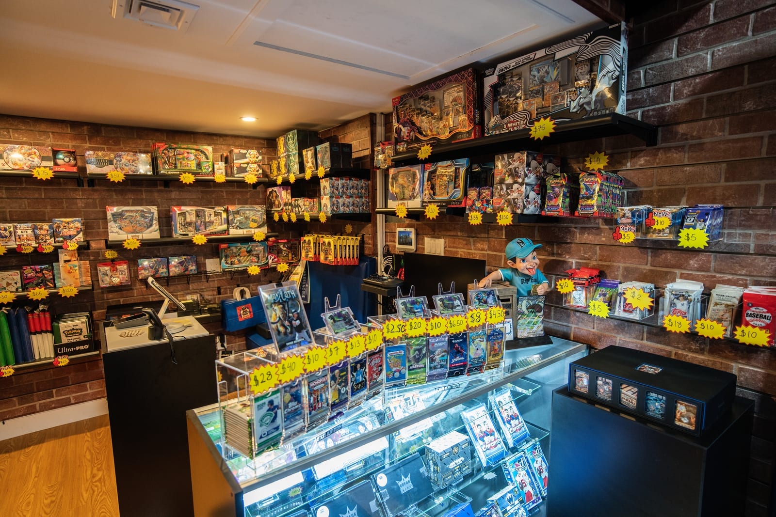 Rip' Em Sports store interior with brick-textured slatwall and retail display fixtures